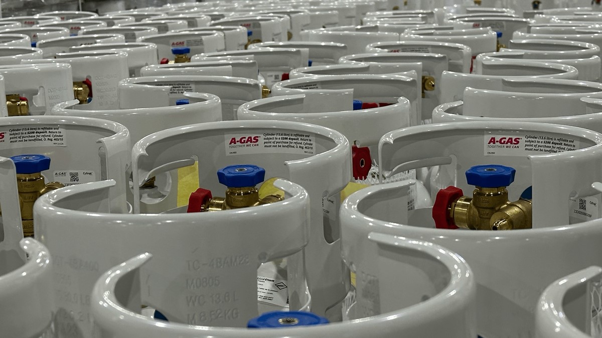 Rows of grey cylinders in a warehouse 