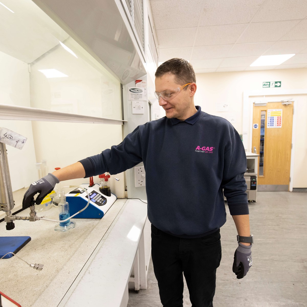 lab technician preparing analysis equipment