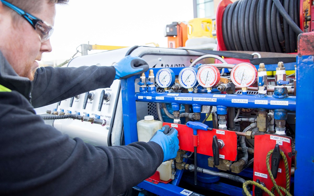 service engineer operating recovery equipment