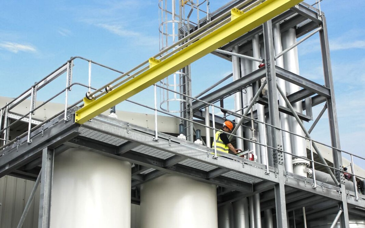 Wide angle shot of a person working on a raised platform above a separator