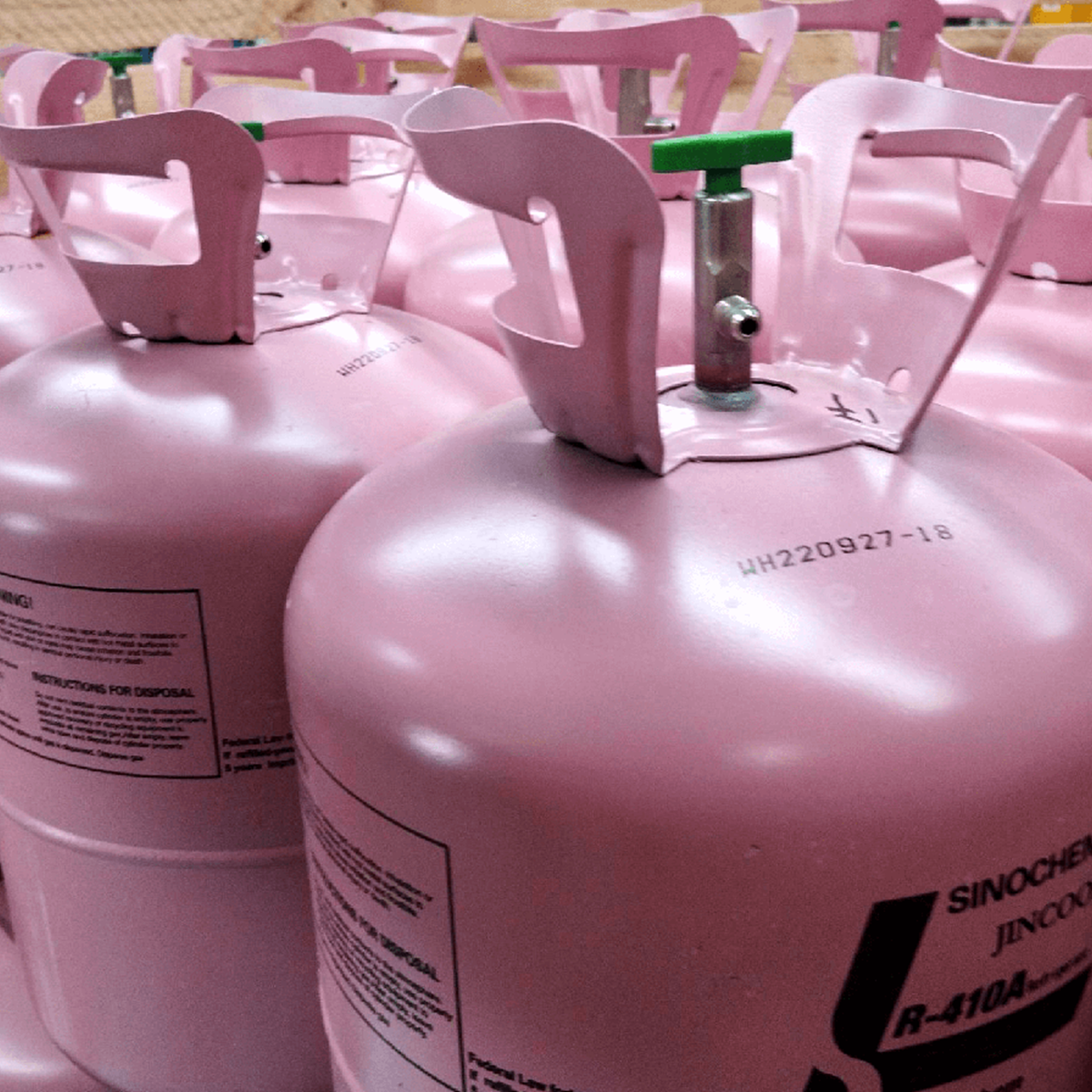Rows of pink disposable cylinders in a warehouse 