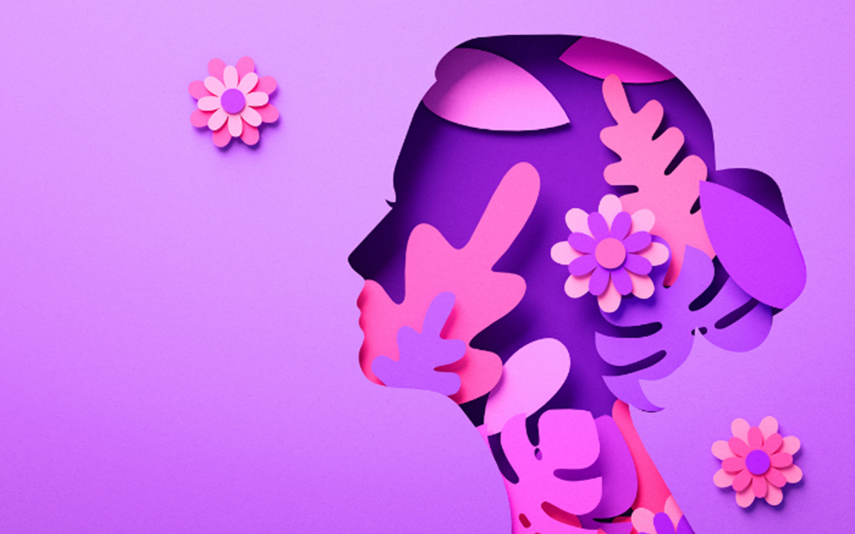 A light purple tile with an artistic depiction of a woman's head with pink flowers and trees 