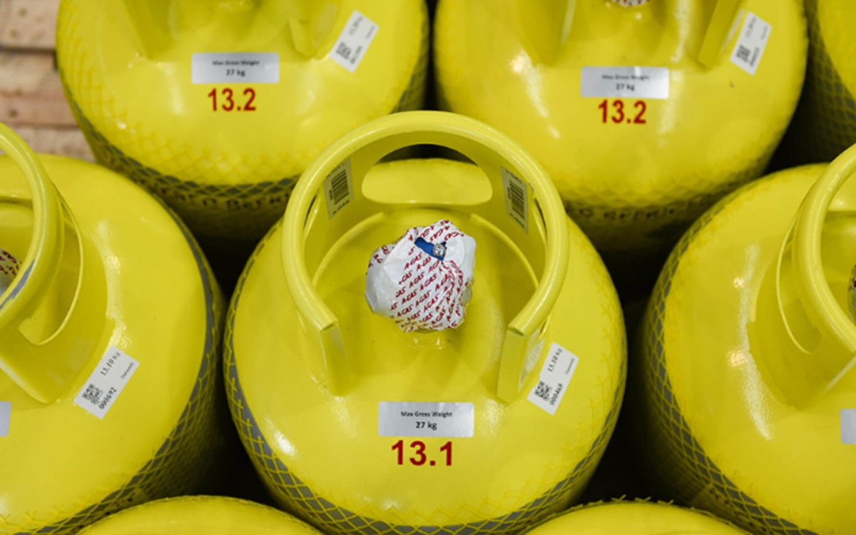 A shot of grey cylinders with yellow tops from above 
